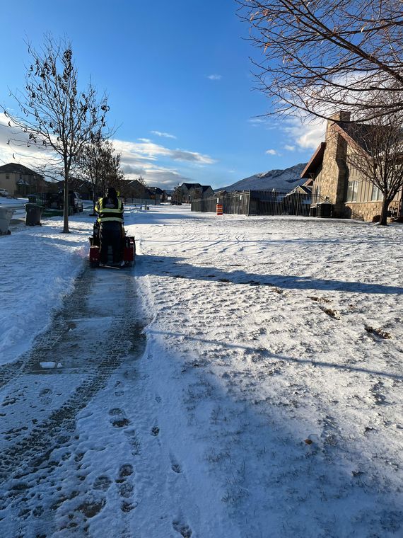 Sidewalk snow clearing with a ride-on