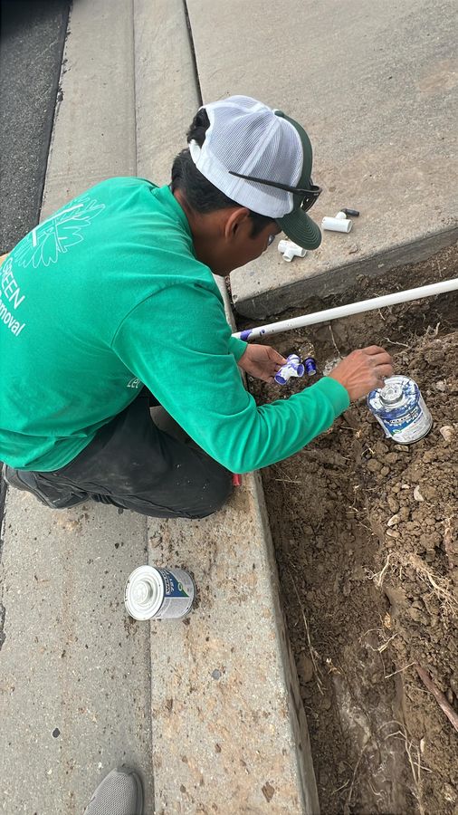 Gluing PVC irrigation pipe in a trench