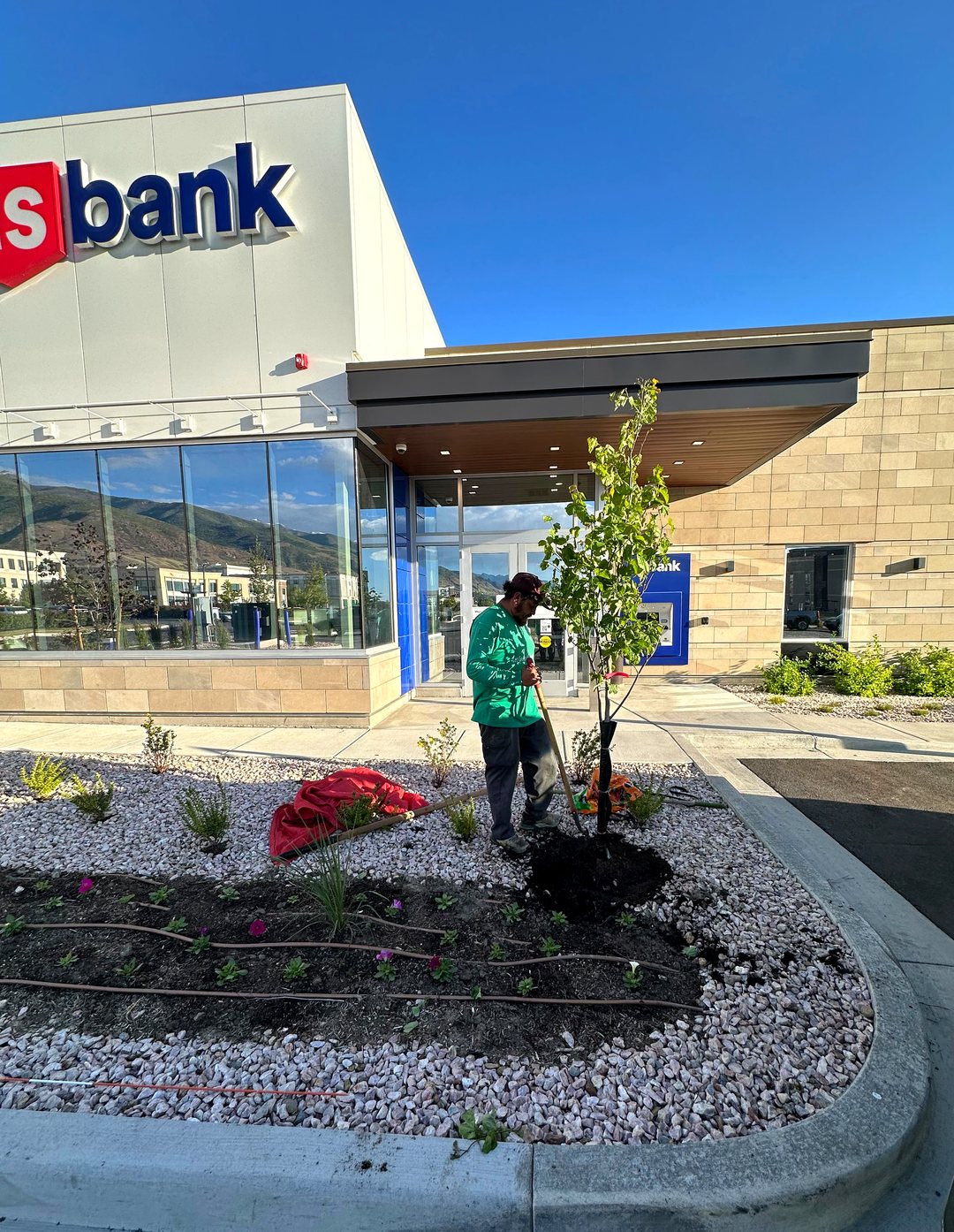 L-BE Green crew planting and maintaining landscaping at a commercial U.S. Bank property in Utah
